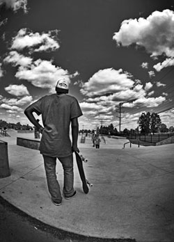 faceless portrait of skateboarder at riley skate park in farmington michigan in black and white